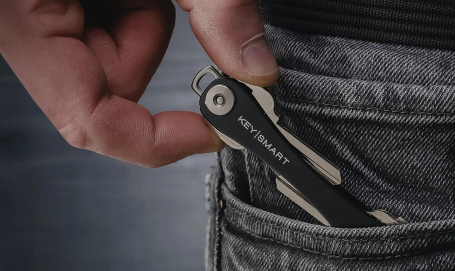 Sliding KeySmart into a jeans pocket