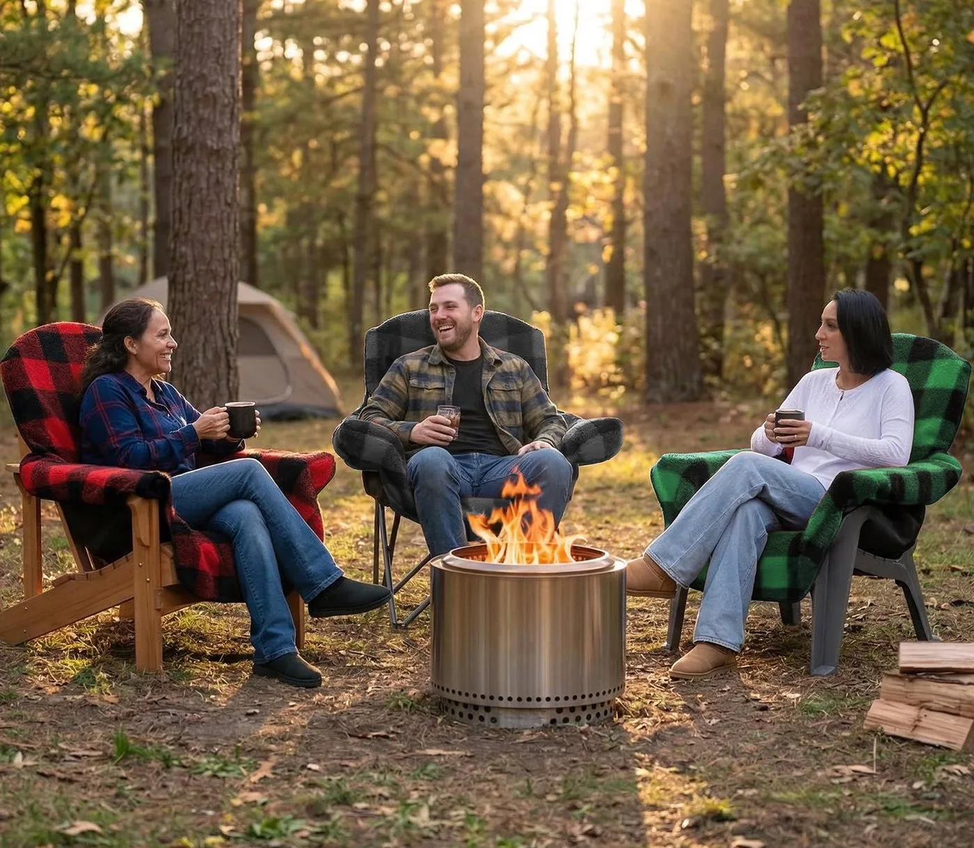 Three people using plaid chair blankets around a firepit in the woods