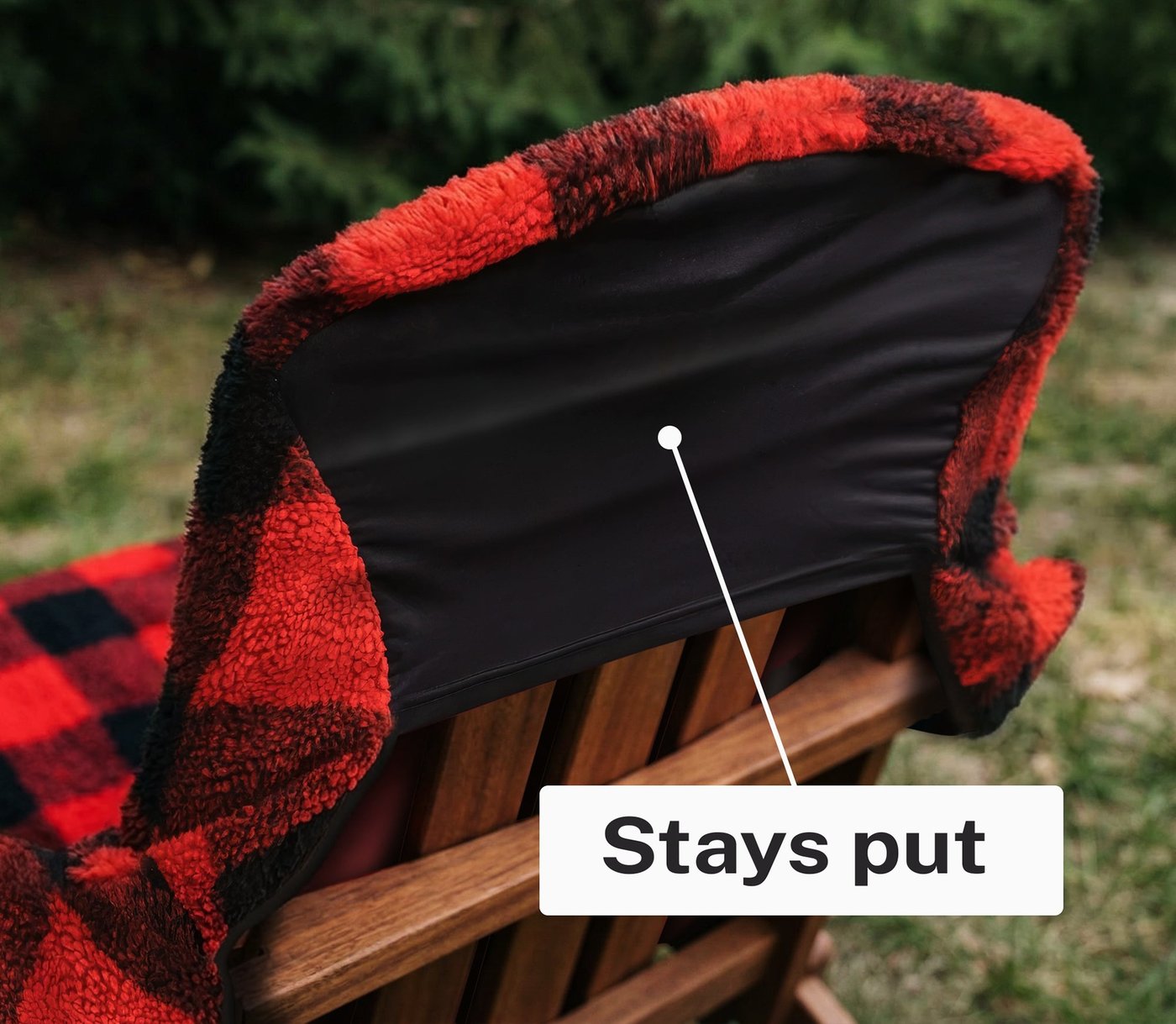 Securing the Chair Blanket's stretch-to-fit back over an outdoor chair