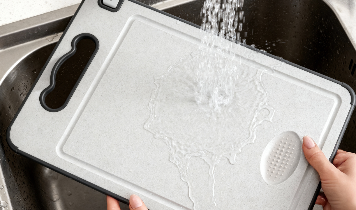 Rinsing the TIBO cutting board under running water