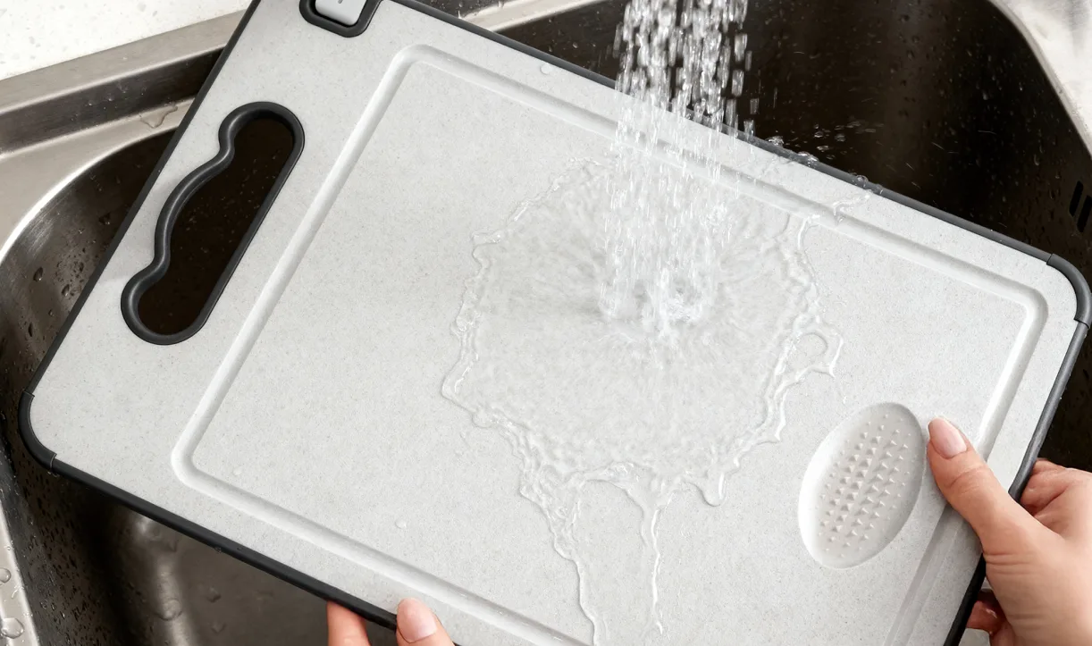 Rinsing the TIBO cutting board under running water