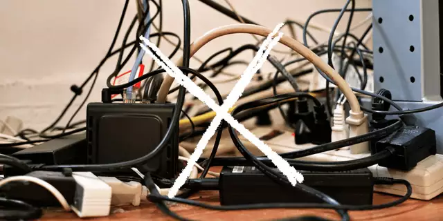 A tangled drawer of mismatched charging cables and power adapters