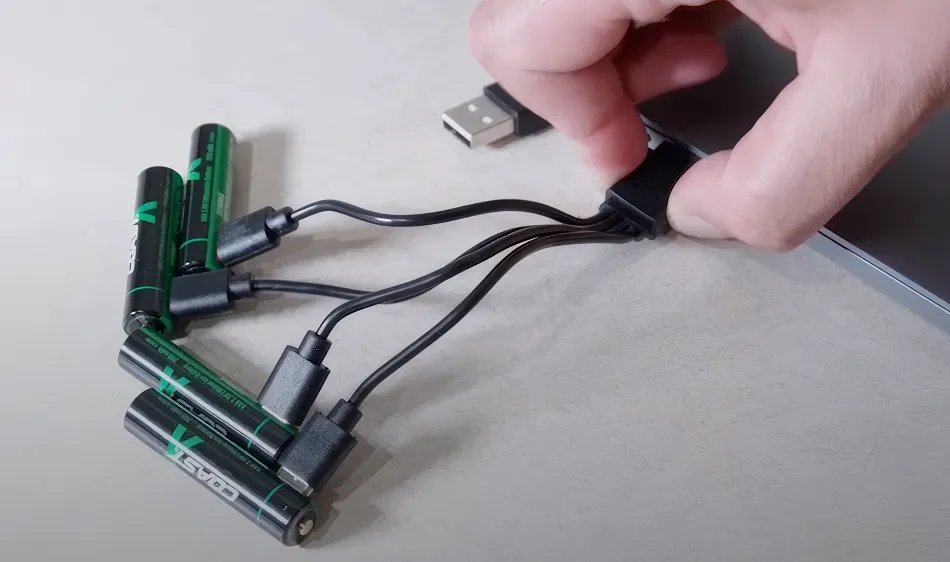ZITHION-X batteries and charging cable on a wooden table