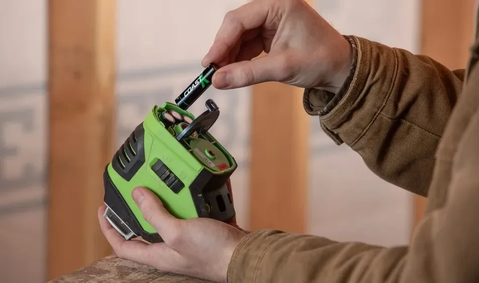 Person inserting a rechargeable battery into a smoke detector with an inset of USB-C charging